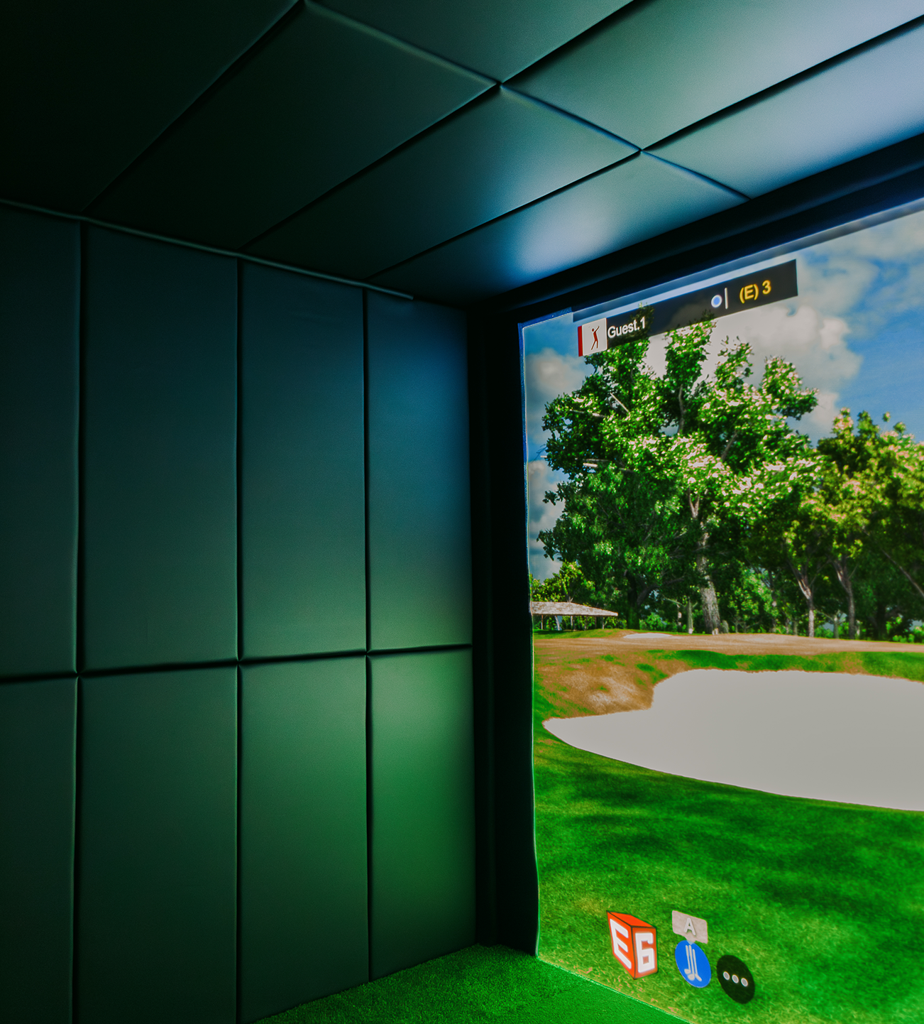Corner of an indoor golf simulator enclosure.