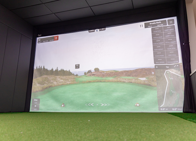 Golf simulator screen showing Arcadia Bluffs hole 11.