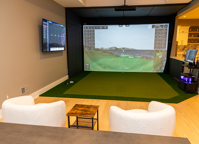 Living room setup with indoor golf simulator.